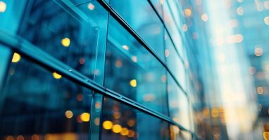 Glass office building with internal lighting