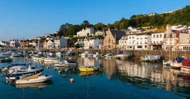 Port side village view with boats and houses in Jersey